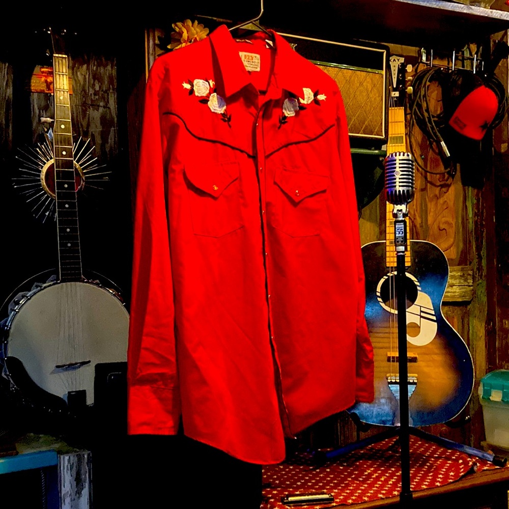 red pearl snap western shirt black piping and embroidered white roses.